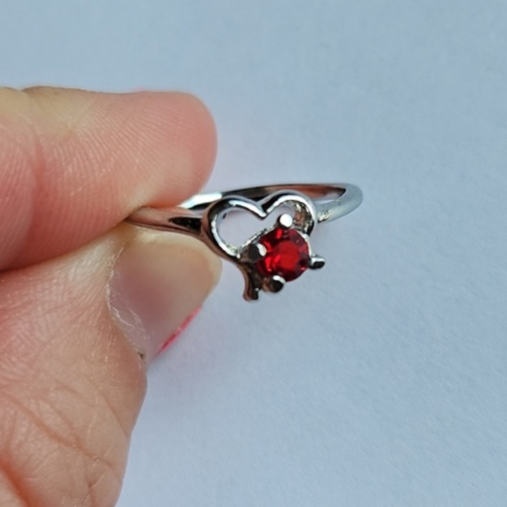 1/$5 or 3/$10 NWOT Ruby Red July Birthstone Ring. Silver-toned (6.5)